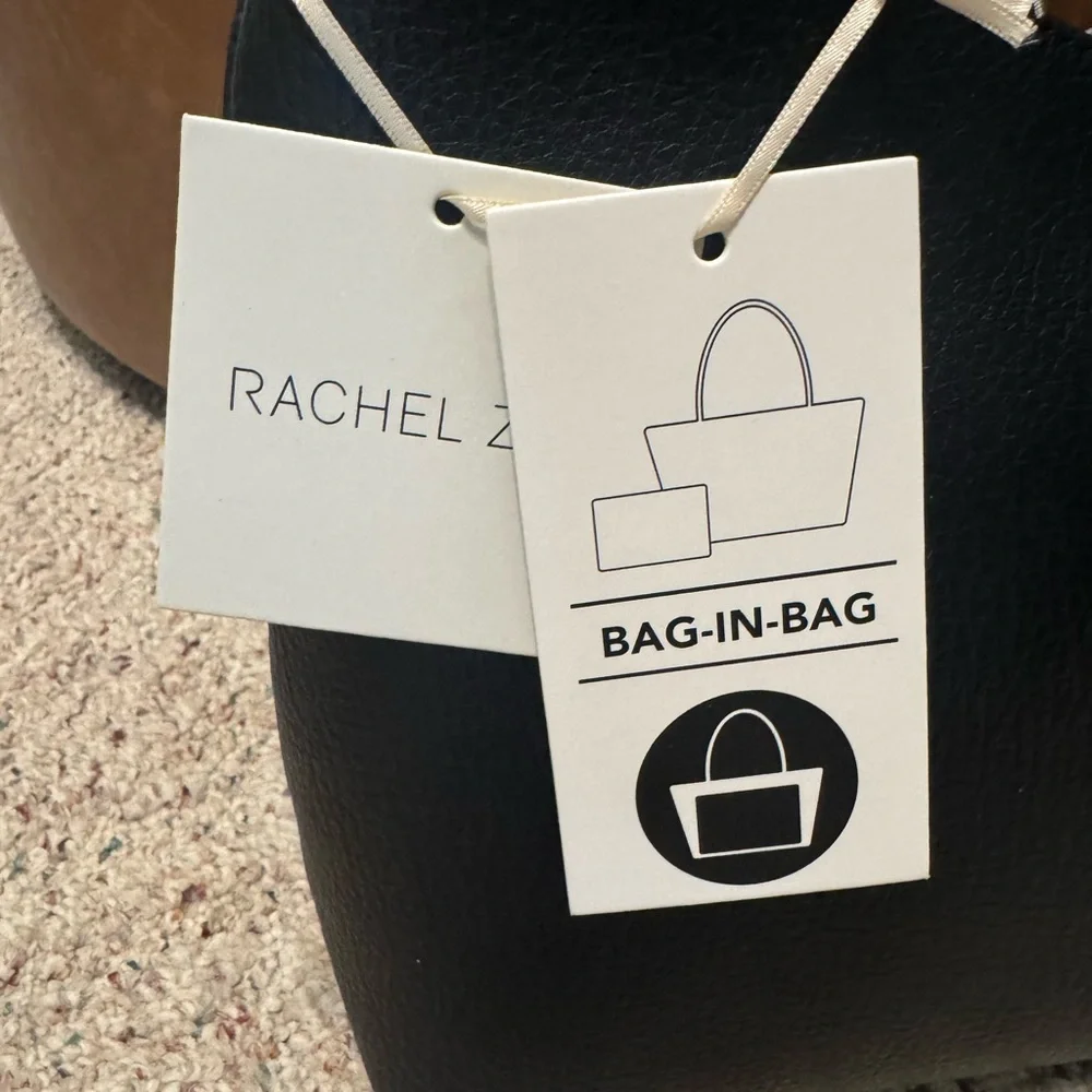 Rachel Zoe. Black leather bag. Extra compartment bag inside, shown in picture.